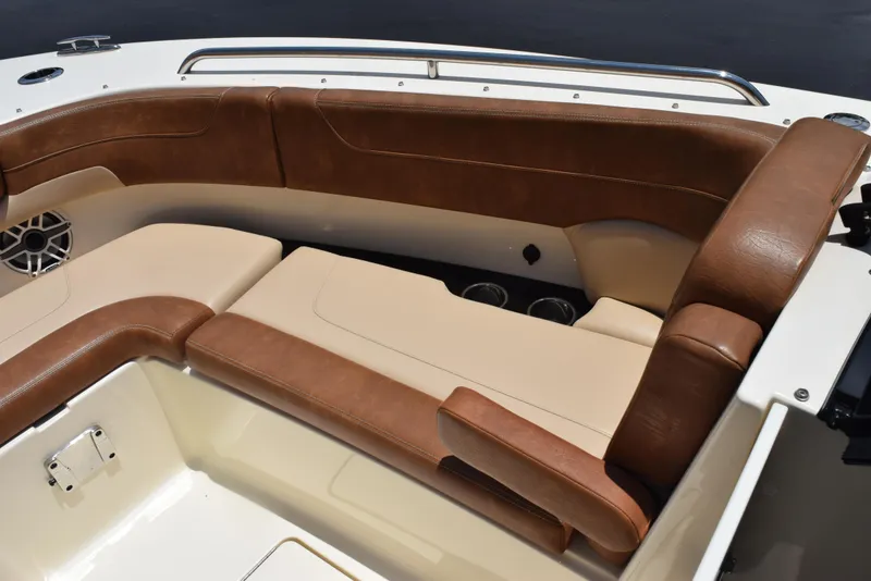 Slide: The Image of 2023 Scout 277 Dorado boat interior with brown and beige seating. - 37