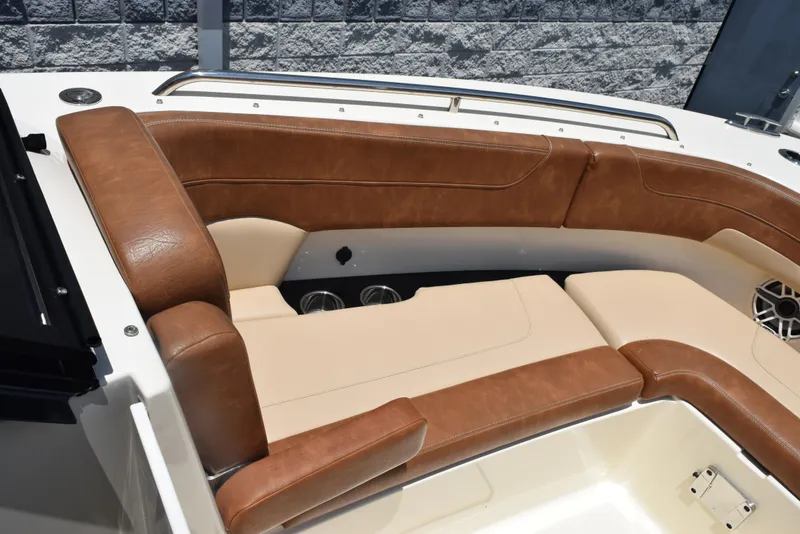 Slide: The Image of 2023 Scout 277 Dorado boat interior with brown leather seating and modern design. - 40