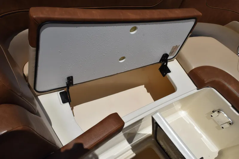 Slide: The Image of 2023 Scout 277 Dorado boat storage compartments with brown seating. - 42