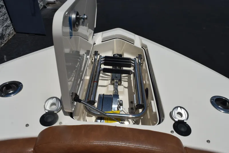 Slide: The Image of 2023 Scout 277 Dorado boat anchor compartment with stainless steel fittings and storage. - 43