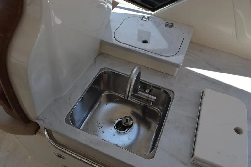 Slide: The Image of 2023 Scout 277 Dorado boat interior with stainless steel sink and countertop. - 46