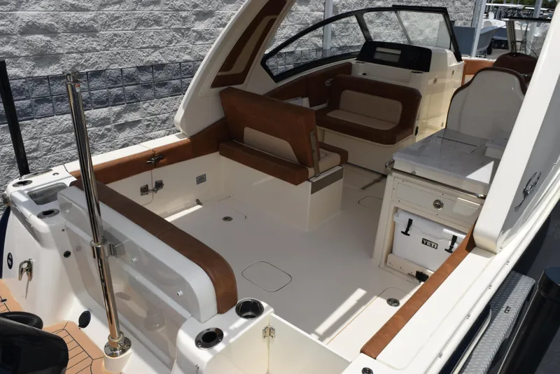 Slide: The Image of 2023 Scout 277 Dorado boat interior with seating and storage, featuring sleek design and modern amenities. - 8