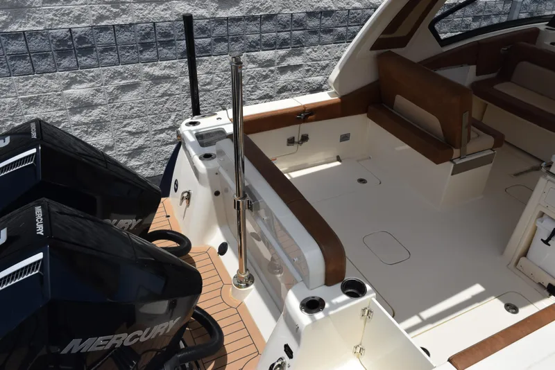 Slide: The Image of 2023 Scout 277 Dorado boat interior with Mercury engines, featuring spacious seating and modern design. - 9