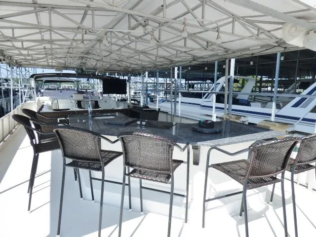 Slide: The Image of Upper deck of 1995 Lazy Days 16x75 houseboat with bar seating and canopy. - 18