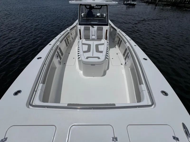 Slide: The Image of 2026 Caymas 44 CT boat with spacious deck and seating on calm water. - 20