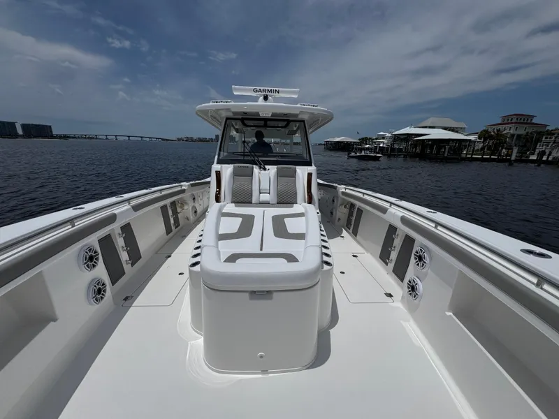 Slide: The Image of 2026 Caymas 44 CT boat on water, featuring spacious deck and modern design. - 22