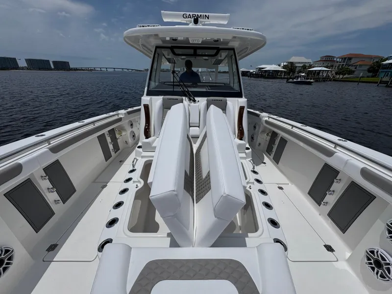 Slide: The Image of 2026 Caymas 44 CT boat with spacious deck and modern seating on the water. - 24