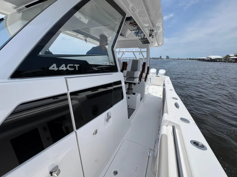 Slide: The Image of 2026 Caymas 44 CT boat on water, sleek design, spacious deck, modern features. - 27