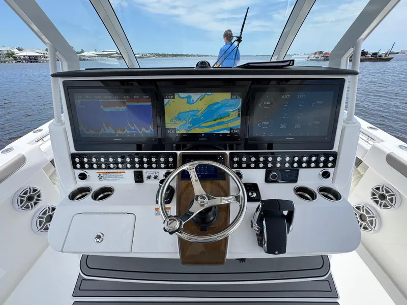 Slide: The Image of 2026 Caymas 44 CT boat dashboard with advanced navigation and control systems. - 36