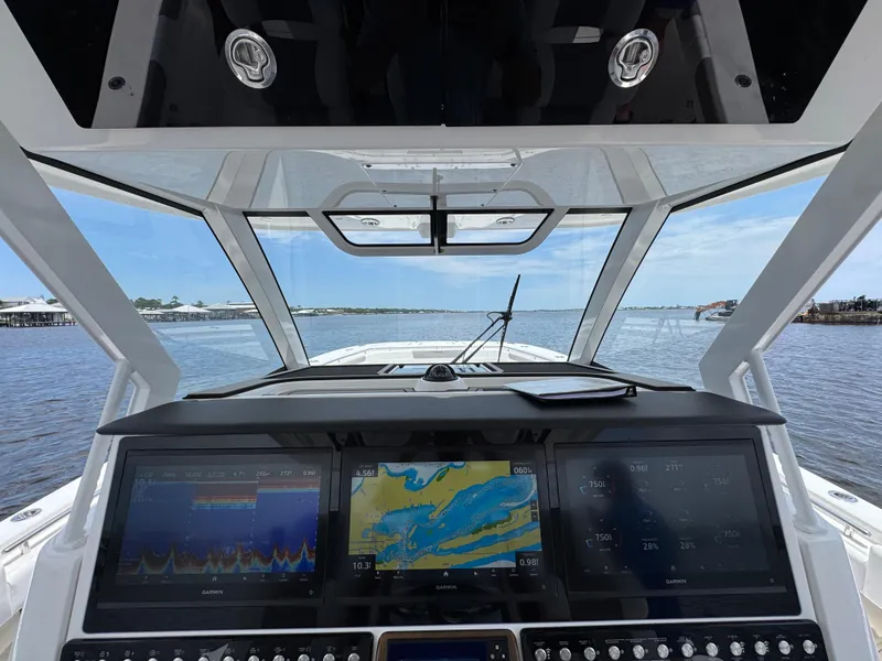 Slide: The Image of Cockpit view of 2026 Caymas 44 CT boat with advanced navigation displays. - 37