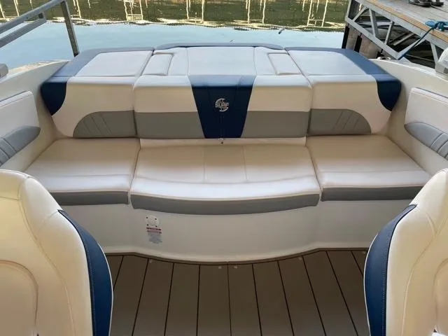Slide: The Image of 2020 Chaparral 21 Surf boat interior with cushioned seating and elegant design. - 12