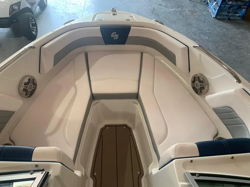 Slide: The Image of 2020 Chaparral 21 Surf boat interior with cushioned seating and speakers. - 15