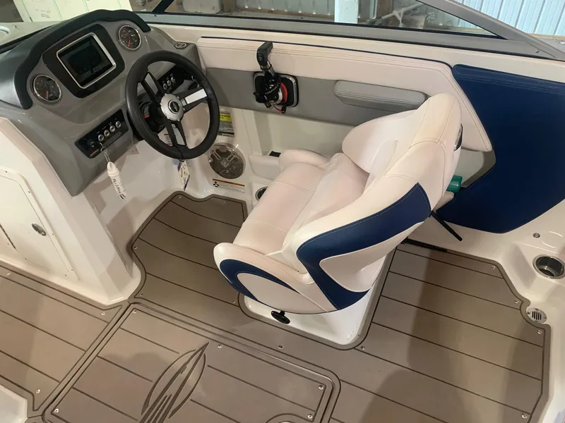 Slide: The Image of 2020 Chaparral 21 Surf boat interior with steering wheel and captain's chair. - 17