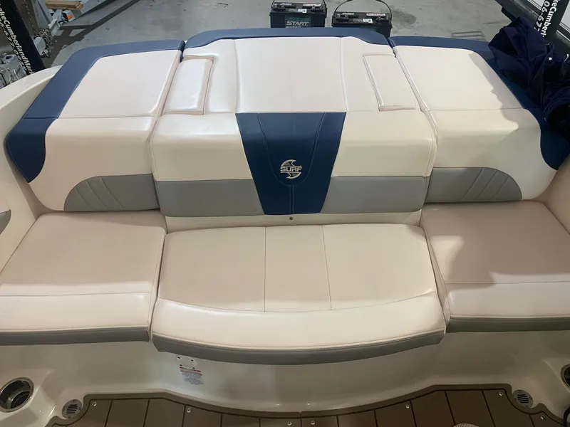 Slide: The Image of 2020 Chaparral 21 Surf boat seating with blue and white upholstery. - 19