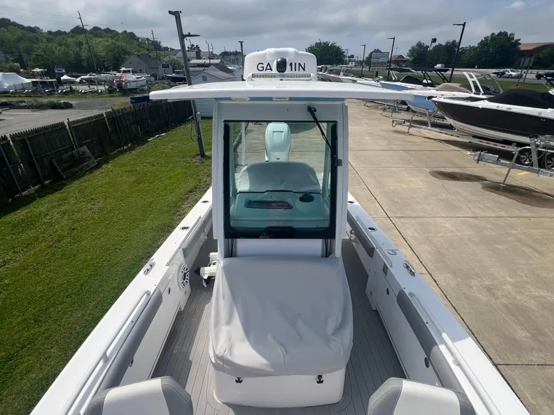 Slide: The Image of 2023 Everglades 253 CC boat with Garmin equipment, docked outdoors. - 5