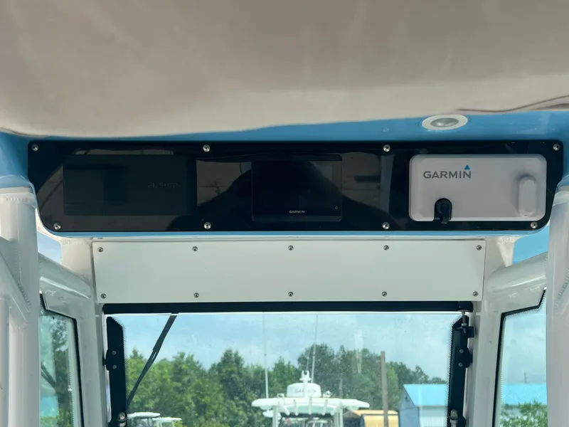 Slide: The Image of Everglades 253 CC 2023 boat dashboard with Garmin navigation system. - 6