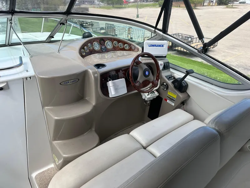 Slide: The Image of 2002 Four Winns 268 Vista boat cockpit with steering wheel and instrument panel. - 16