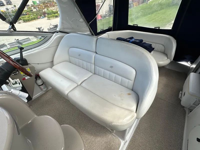 Slide: The Image of 2002 Four Winns 268 Vista boat interior with white leather seating and carpeted floor. - 18