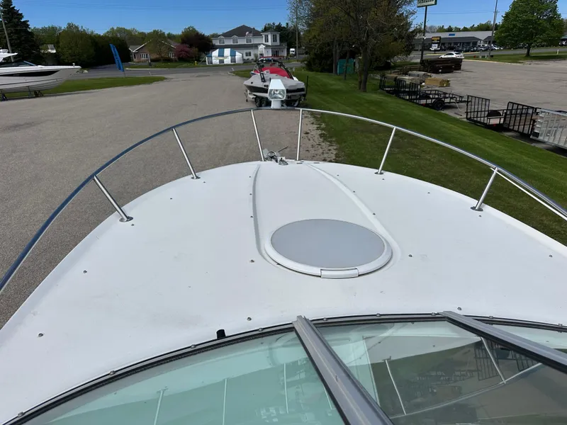 Slide: The Image of 2002 Four Winns 268 Vista boat bow view in a marina setting. - 8