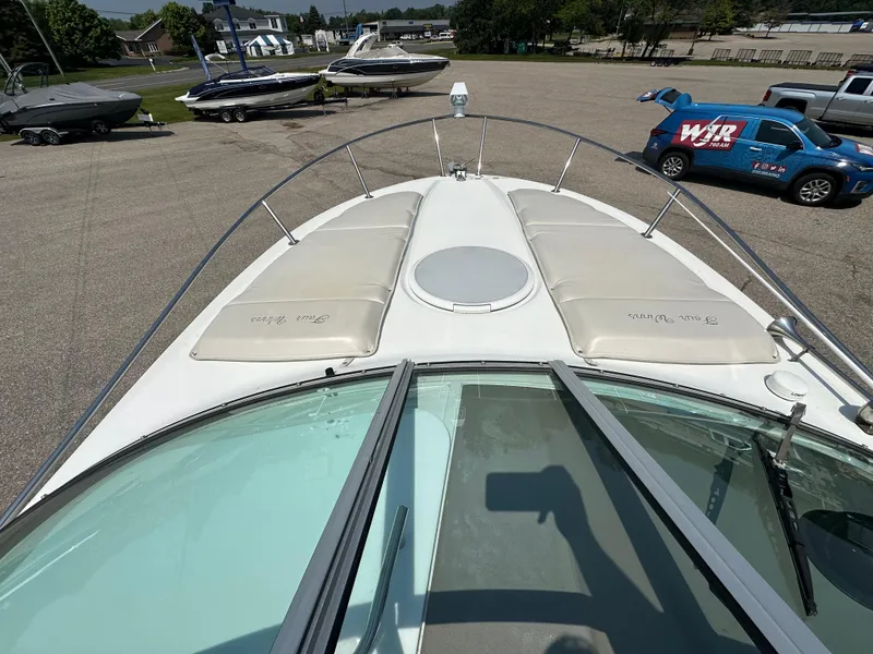 Slide: The Image of 2002 Four Winns 268 Vista boat deck view with sunpads and windshield. - 9