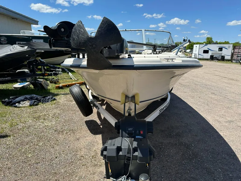 Slide: The Image of 2003 Sea Hunt Escape 186 boat on trailer, parked outdoors under a clear blue sky. - 6