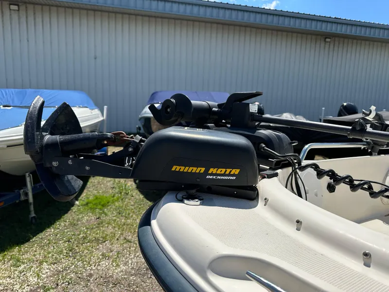 Slide: The Image of Minn Kota trolling motor on 2003 Sea Hunt Escape 186 boat, parked outdoors. - 7