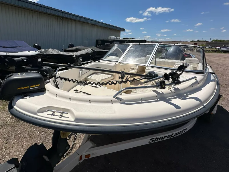 Slide: The Image of 2003 Sea Hunt Escape 186 boat on ShoreLand'r trailer, parked outdoors under clear sky. - 8