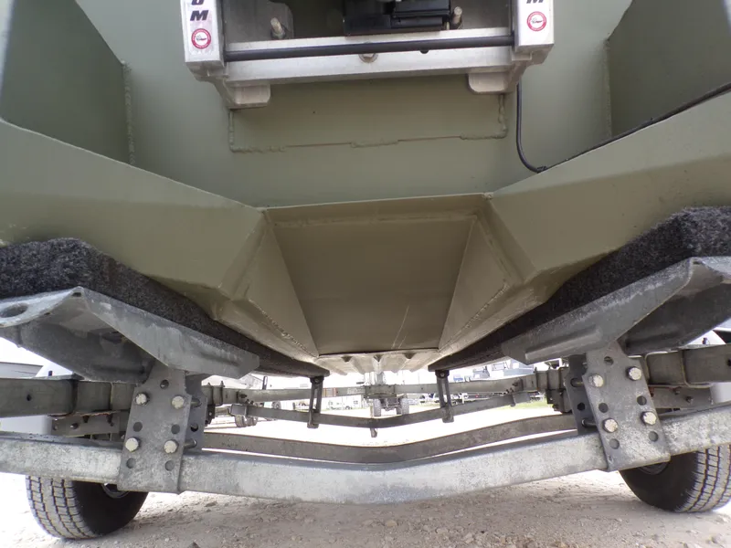 Slide: The Image of 2024 Southfork 1662 EXLSF boat trailer undercarriage, showcasing suspension and support structure. - 11