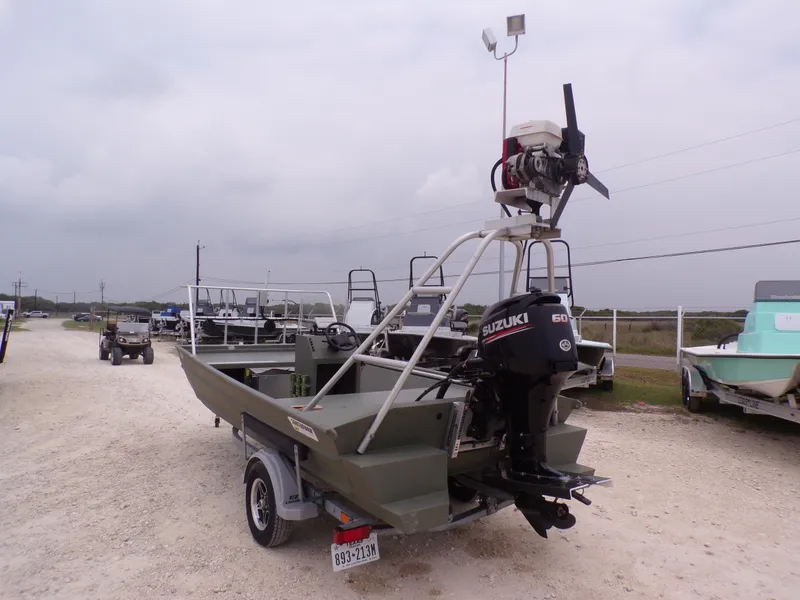 Slide: The Image of 2024 Southfork 1662 EXLSF boat with Suzuki outboard motor on a trailer. - 12