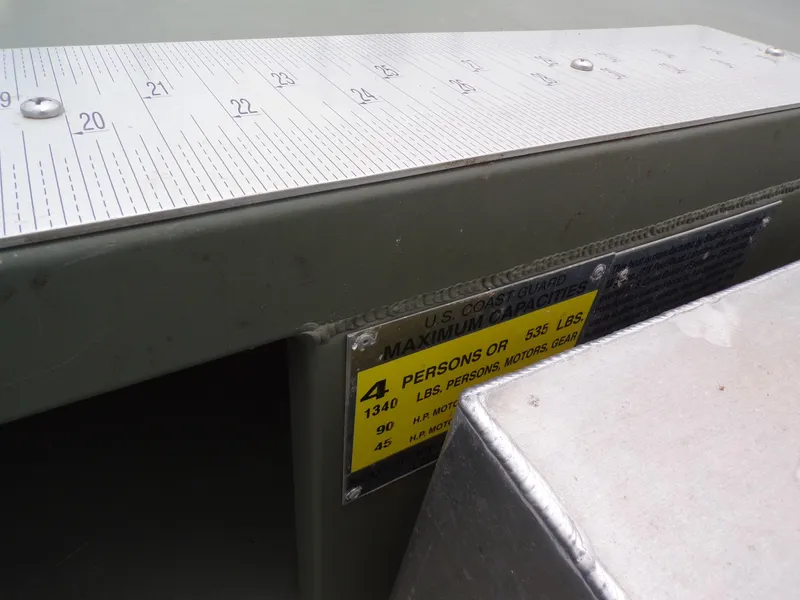 Slide: The Image of 2024 Southfork 1662 EXLSF boat capacity label and measurement scale. - 16