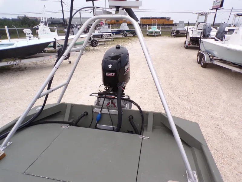 Slide: The Image of 2024 Southfork 1662 EXLSF boat with Suzuki 60 outboard motor in a dealership lot. - 20
