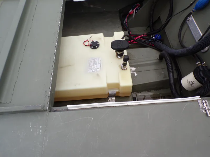 Slide: The Image of 2024 Southfork 1662 EXLSF boat interior showing fuel tank and wiring components. - 27