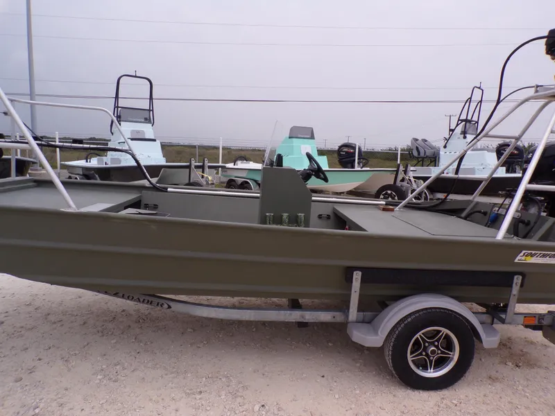 Slide: The Image of 2024 Southfork 1662 EXLSF boat on trailer, displayed outdoors. - 28