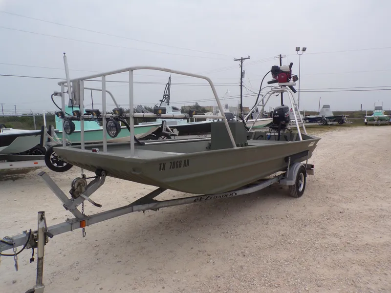 Slide: The Image of 2024 Southfork 1662 EXLSF boat on trailer, parked outdoors. - 3