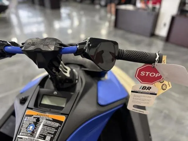 Slide: The Image of 2025 Sea-Doo Spark Trixx Waverunner handlebars with iBR tag in showroom. - 11
