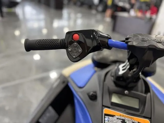 Slide: The Image of 2025 Sea-Doo Spark Trixx handlebar controls, featuring ergonomic grip and control buttons. - 7