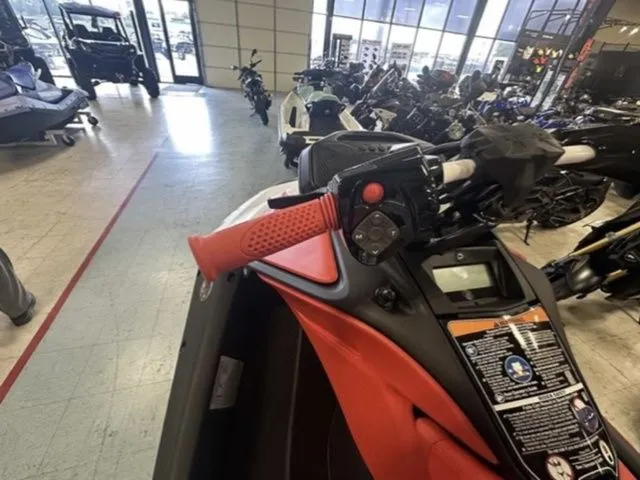 Slide: The Image of 2025 Sea-Doo Spark Trixx in showroom, close-up of handlebars. - 12