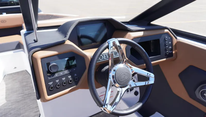 Slide: The Image of 2024 Cobalt CS23 boat dashboard with modern steering wheel and control panel. - 19
