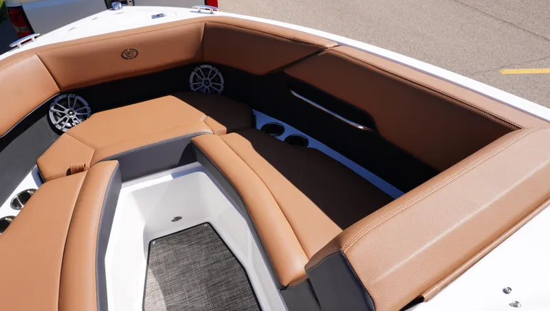 Slide: The Image of 2024 Cobalt CS23 boat interior with tan seating and modern design. - 26