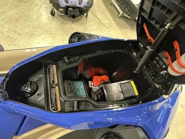 Slide: The Image of 2025 Sea-Doo Waverunner Wake storage compartment open, revealing interior contents. - 12