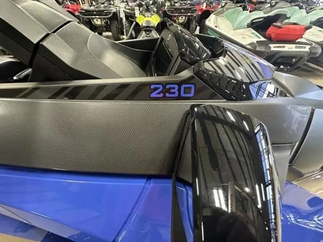 Slide: The Image of 2025 Sea-Doo Waverunner Wake 230, sleek design, displayed in showroom. - 15