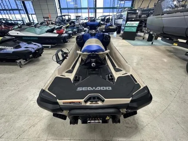 Slide: The Image of 2025 Sea-Doo Waverunner Wake in showroom, rear view, surrounded by other watercraft. - 16