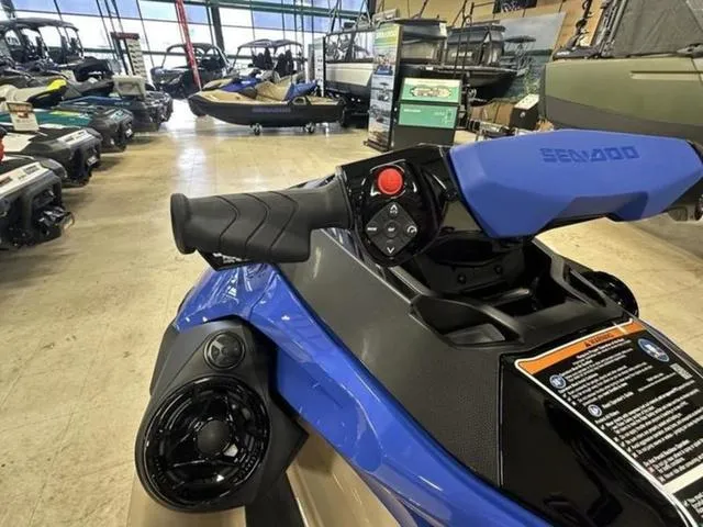 Slide: The Image of 2025 Sea-Doo Waverunner Wake in showroom, showcasing handlebars and controls. - 20