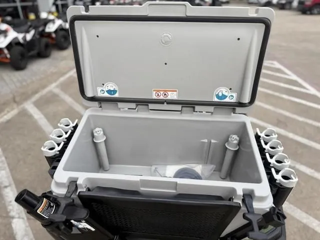 Slide: The Image of Open storage compartment on 2025 Sea-Doo Waverunner FISH PRO, featuring multiple rod holders. - 12