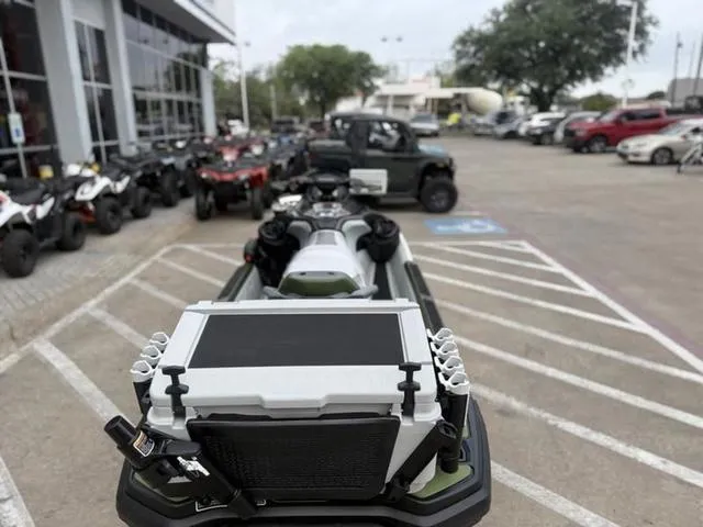 Slide: The Image of 2025 Sea-Doo Waverunner FISH PRO parked in dealership lot with other vehicles. - 14