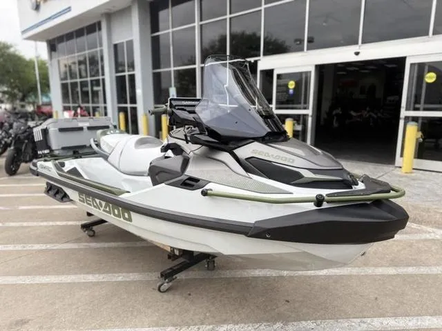 Slide: The Image of 2025 Sea-Doo Waverunner FISH PRO parked outside a dealership. - 2