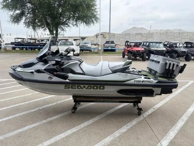 Slide: The Image of 2025 Sea-Doo Waverunner FISH PRO on display in a parking lot. - 5