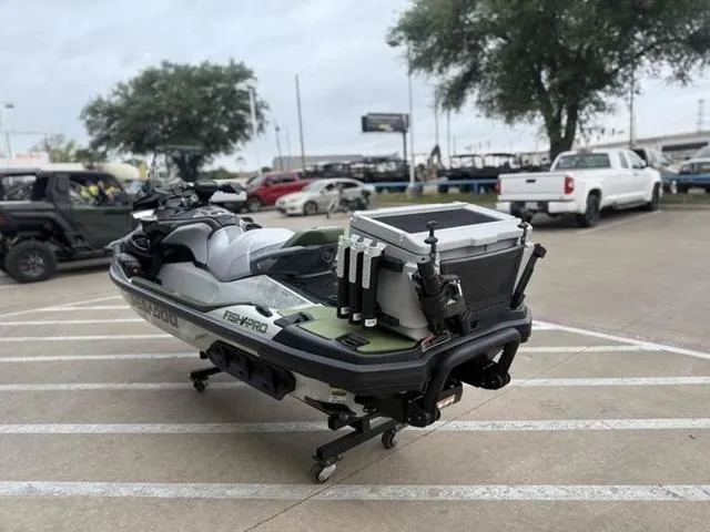 Slide: The Image of 2025 Sea-Doo Waverunner FISH PRO parked in a lot, equipped for fishing. - 6