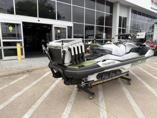 Slide: The Image of 2025 Sea-Doo Waverunner FISH PRO parked outside a dealership. - 8