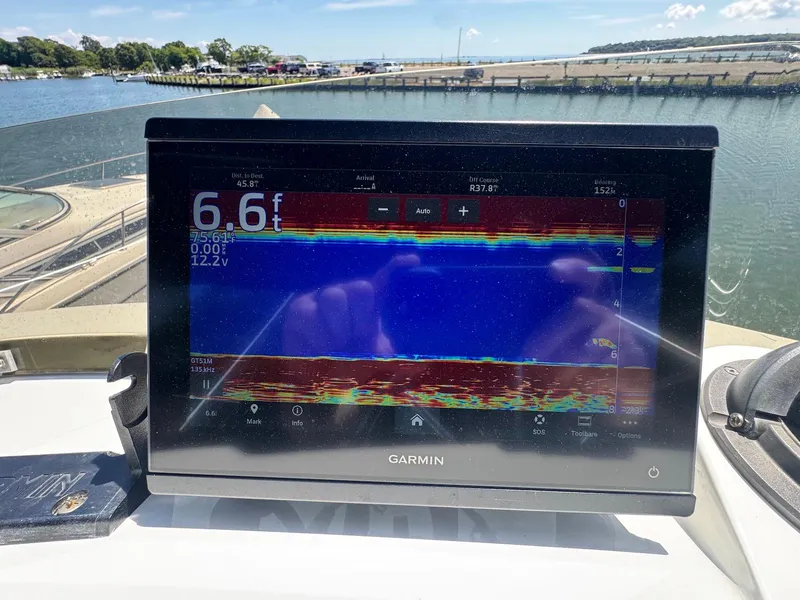 Slide: The Image of Garmin fishfinder display on 1973 Bertram 28 Sport Fisherman, showing water depth and sonar data. - 16